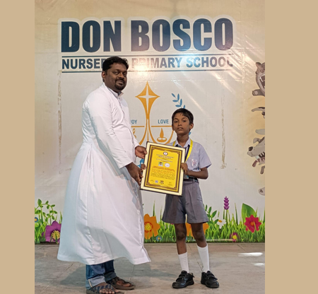 Morning Assembly (28.07.2025) Master Sharan of our school took part in the Universal Achievers Book of Records World's largest silambam Kids Fitness Workshop and received the Certificate of Achievement.Rev. Fr. Hendrick presented the Shield and Medil to Master Sharan.
